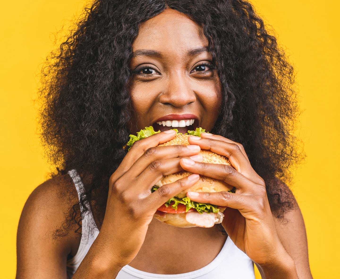 woman eating burger